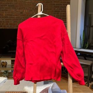 red sweater with big sleeves